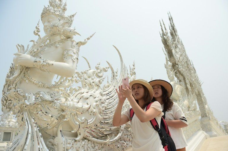 afp-chinese-tourists-boost-thai-economy-but-stir-outrage